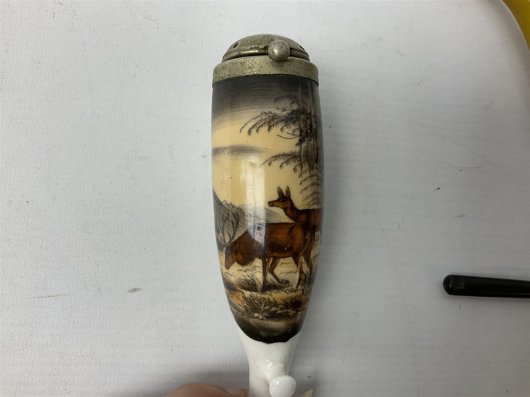 Carved meerschaum and amber pipe with silver mount, the bowl carved as a woman, cased, clay pipe in the form of an acorn, ceramic pipe, five other pipes and a ceramic bottle pourer in the form of a horse  