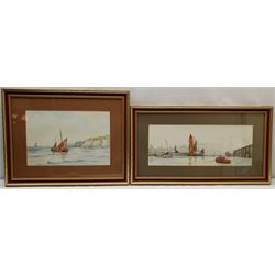 Ken Wigg (British 20th century): 'A Peaceful Morning' Scarborough Harbour and Whitby Coble off the Shore, two watercolours signed, one titled verso 25cm x 37cm and 19cm x 49cm (2)
