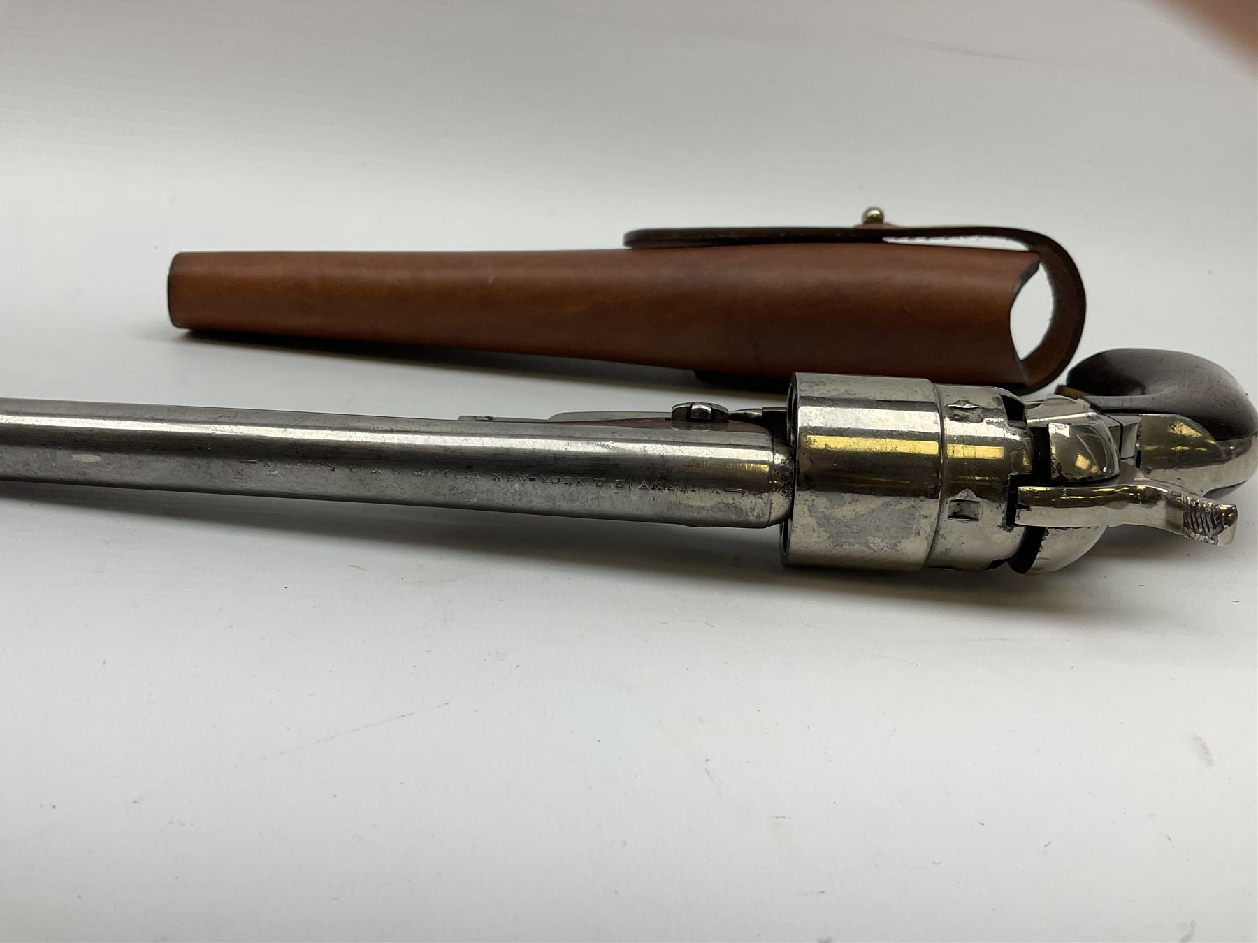 Colt model 1860 .44 calibre six-shot percussion army revolver with stepped cylinder, the 20.5cm barrel inscribed 'Address Col Saml Colt New York US America' with under barrel rammer, all parts with matching serial no.77902, traces of plating to brass trigger guard, two-piece walnut grips L37cm; with modern brass bullet maker and leather holster