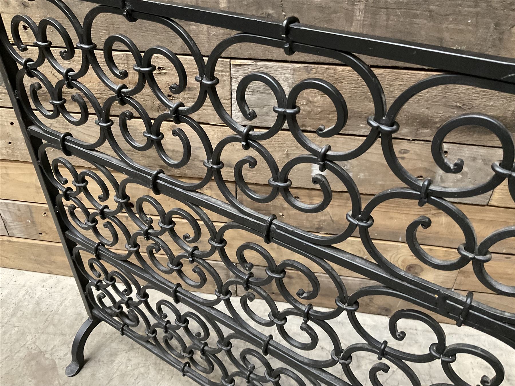 Black painted wrought iron fire guard , wicker log basket with stand, coal bucket and a fire kerb (4)