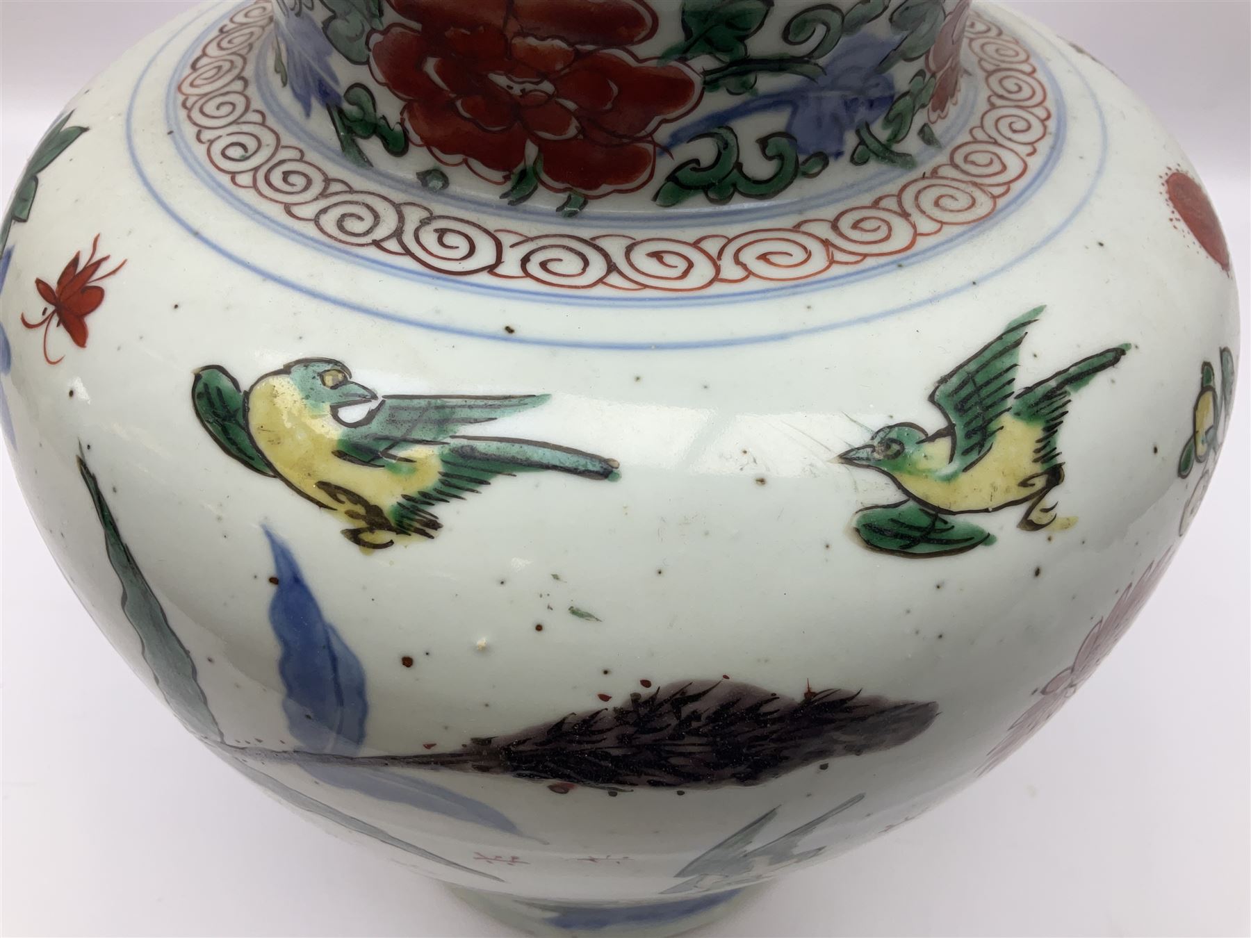 19th century Chinese Wucai vase and cover, decorated  with peacock on blue rockwork and other birds flying amongst tree peonies, H43cm