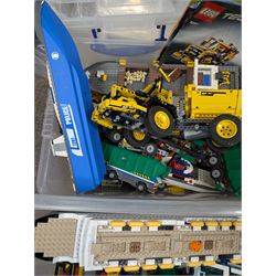 Two boxes of partially built Lego vehicles, including Lego Technics Dumper Truck no. 8264, Titanic, container ships, police boat, smaller police vehicles, etc