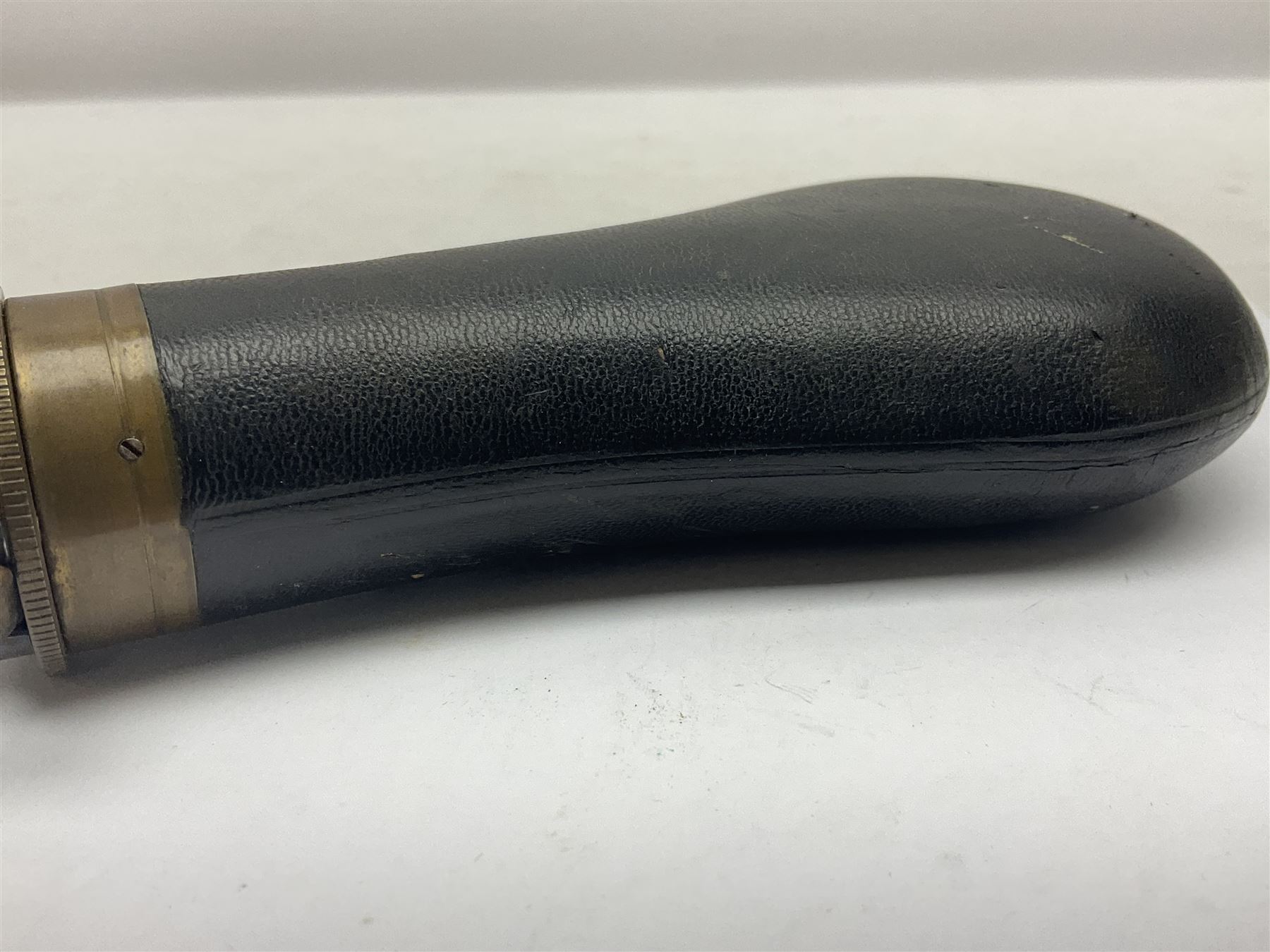 19th century James Dixon & Sons leather covered powder flask with patent action adjustable shot measure to dispense 2 1/4 - 3 drams; marked Parker Hale Ltd. Birmingham England L20cm