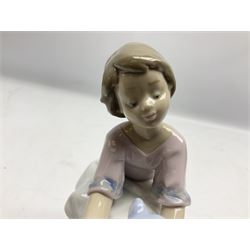 Six Lladro figures, comprising Naughty Dog no 4982, Best Friend 7620 and My Buddy no 7609, Kitty Confrontation no 1442, It Wasn't Me no 7672 and Rabbit Eating no 4772, three with original boxes, largest example H22cm