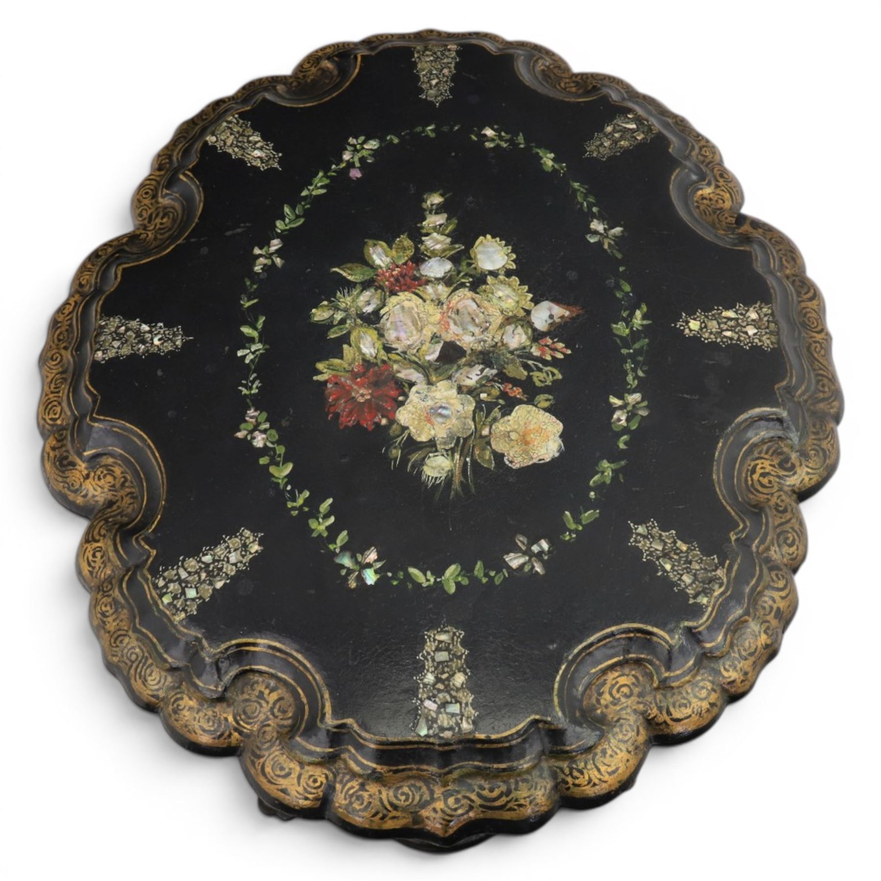 Victorian papier mache table, tilt top with painted decoration and mother of pearl inlay, raised on a baluster column shaped base terminating in pad feet