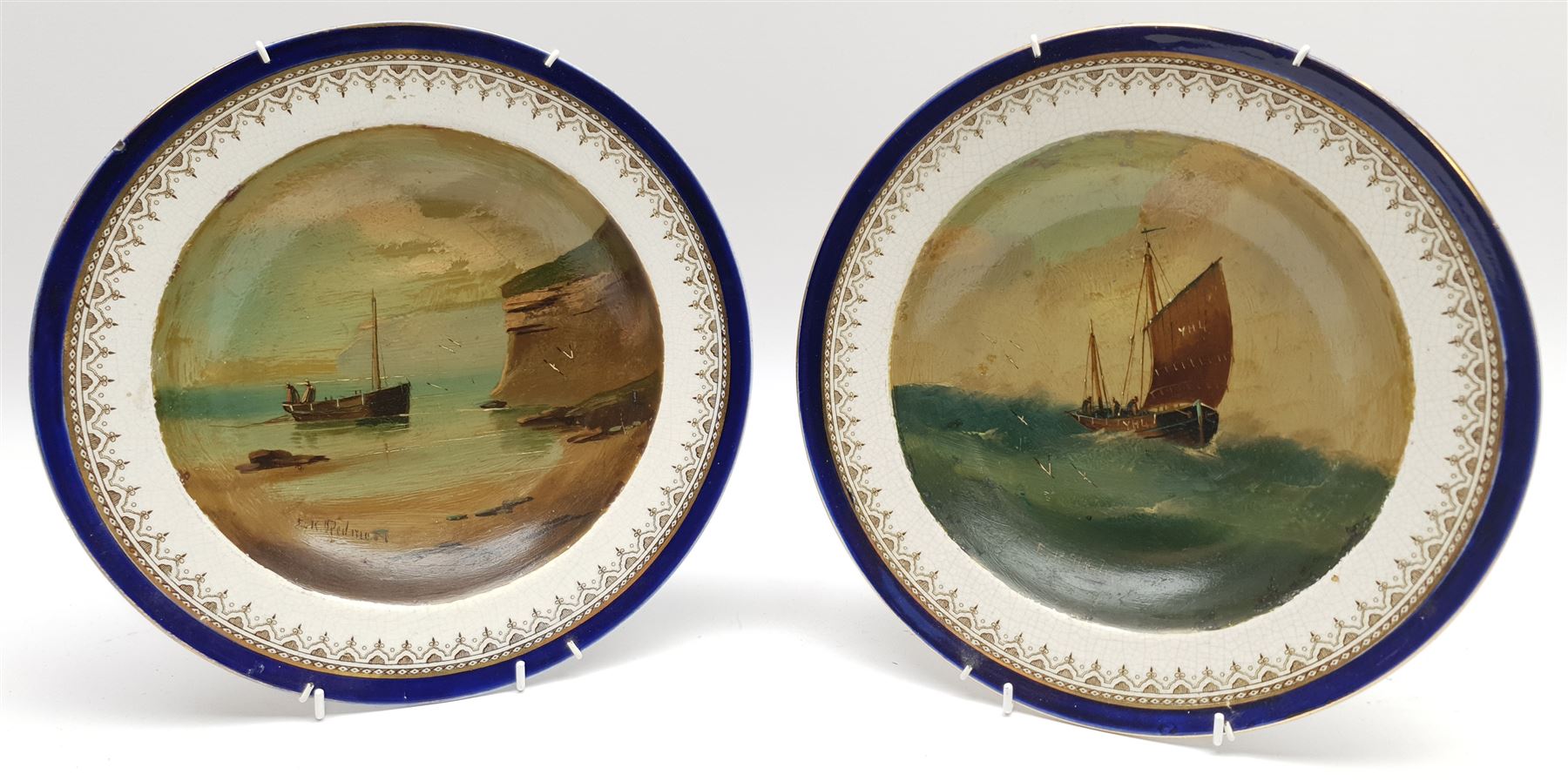 Edward King Redmore (British 1860-1941): Whitby Boats passing a Buoy, oil on canvas signed 16cm x 24cm; Low Tide and Yarmouth Sailing Boat, pair oils on Royal Doulton soup plates signed 19cm diameter (3)