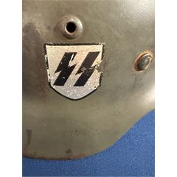German Third Reich Waffen-SS M35 double decal helmet, the left inner brim stamped SF64, the back inner brim stamped 3866, with leather eight tongue liner and chinstrap