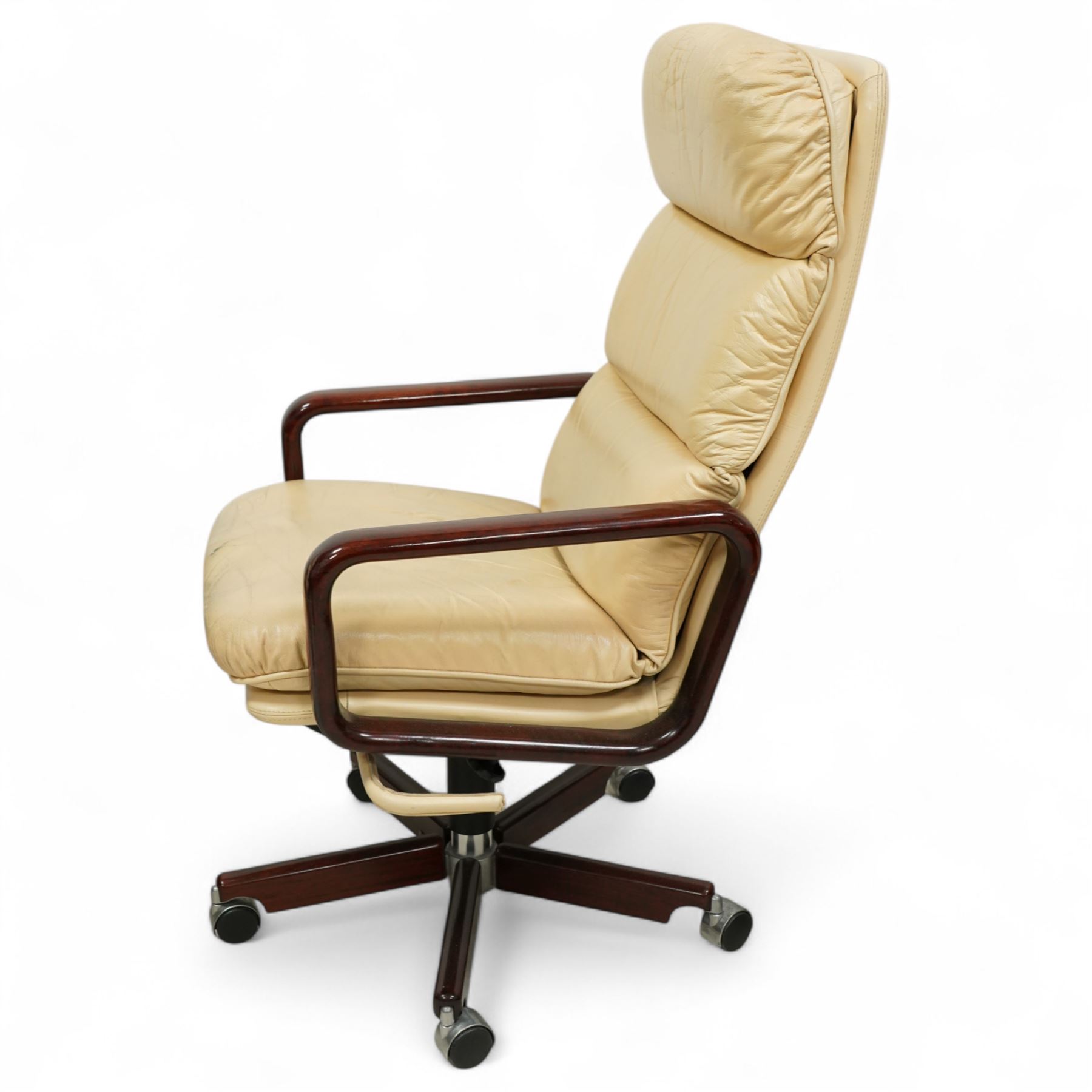 Dyrlund - contemporary pair of armchairs with solid Santos rosewood frame, rounded edges and broad armrests, seat and backrest with a removable cream leather over-stuffed cushions, together with a classic Dyrlund office chair with teak swivel base and cream leather upholstery, 62x44x109cm, (3)


Note: Dyrlund is a Danish furniture manufacturer known for its high-quality, handcrafted pieces, particularly in the mid-century modern style. Founded in 1960 by Frits Hjerte Dyrlund in Rude, Denmark, the company has remained a family business, now run by the second and third generations. Dyrlund specializes in both home and executive office furniture, focusing on practicality, solid construction, and classic design. 
