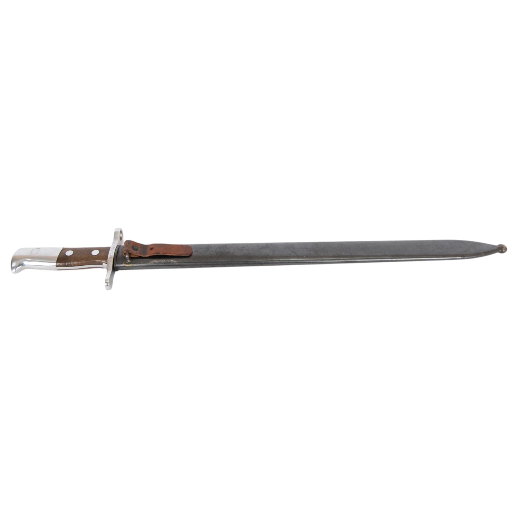 Swiss Pioneer bayonet, with 48cm saw back blade marked to the riccaso Waffenfabrik Neuhausen, steel crossguard marked 752176, with metal scabbard, overall L64cm