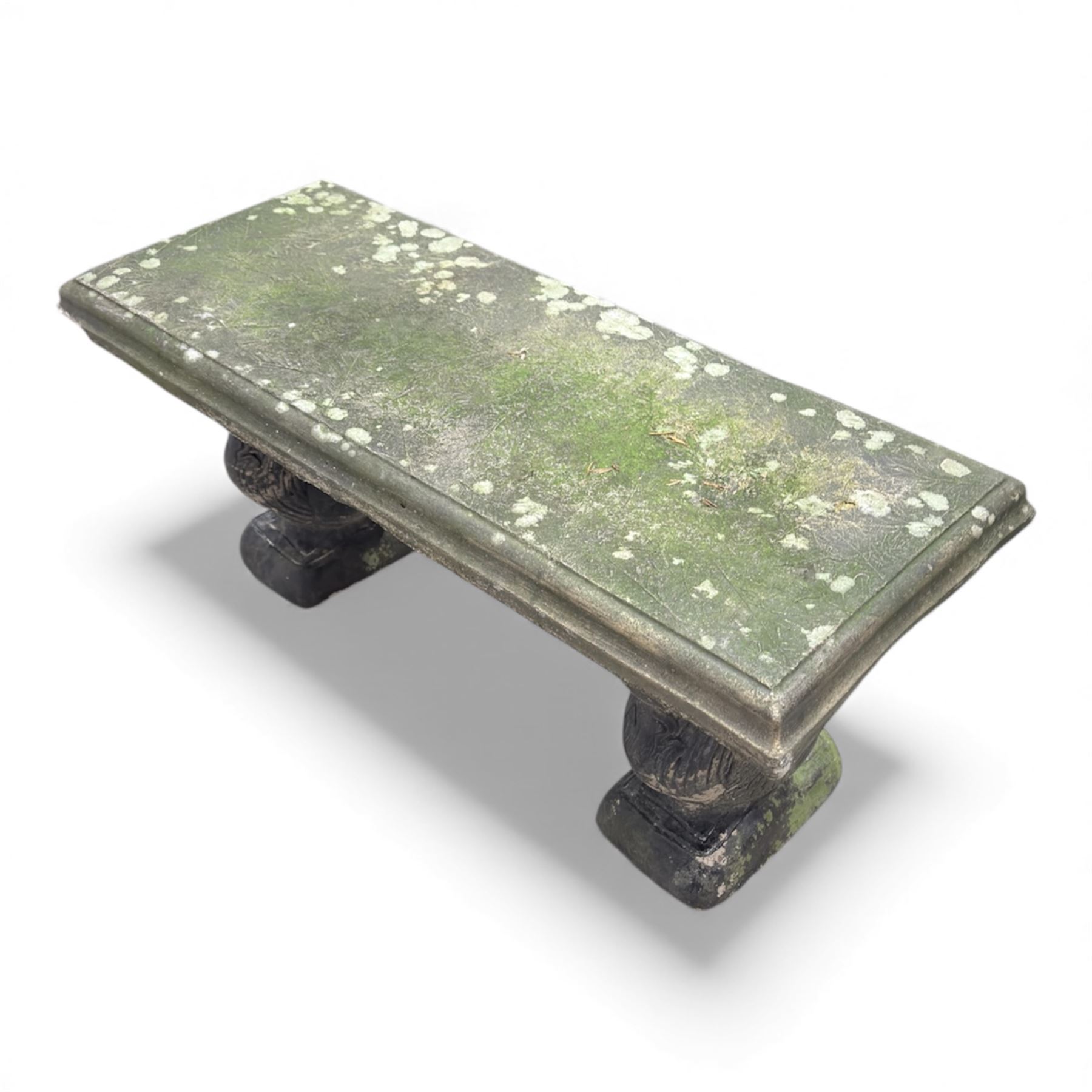 Weathered cast-stone garden bench with squirrel designed supports and rectangular top