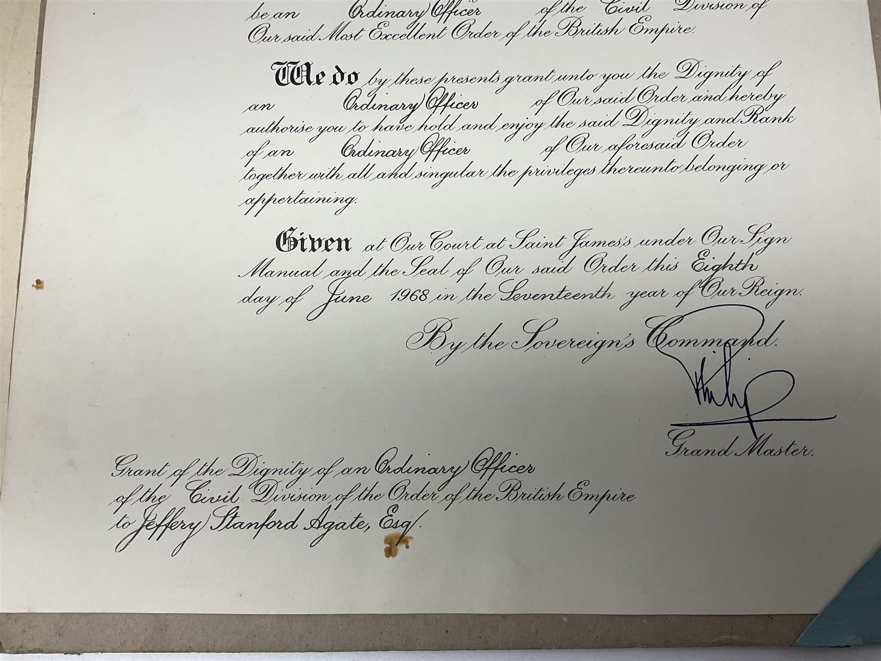 George VI Knight of the Garter cloth beret insignia with pin back and photograph of the Knight's Robes; Edmund Fellowes book on The Knights of the Garter 1348-1939; together with EIIR civilian OBE certificate to Jeffery Stanford Agate with facsimile signatures of Elizabeth II and Prince Philip