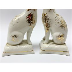 Pair of Victorian Staffordshire cats, modelled seated upon cushions, with gilt detail throughout, H18cm