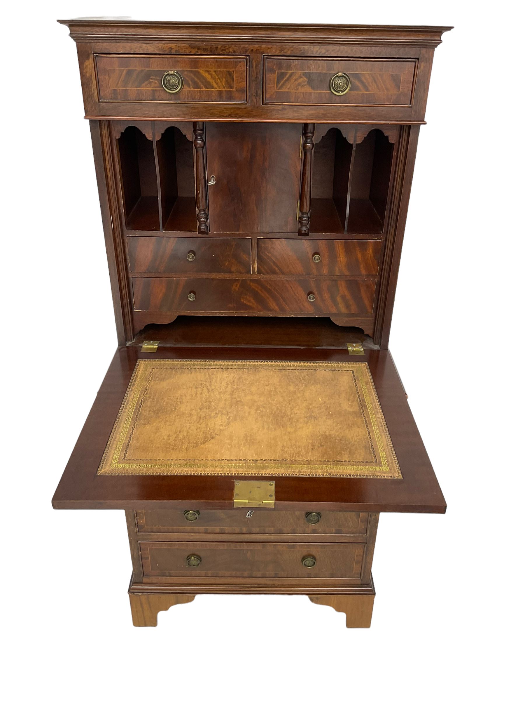 Shaw of London - mahogany secretaire chest, the upper section fitted with two drawers over fall front enclosing drawers, cupboard and pigeon holes, the lower section fitted with four graduating drawers, on bracket feet