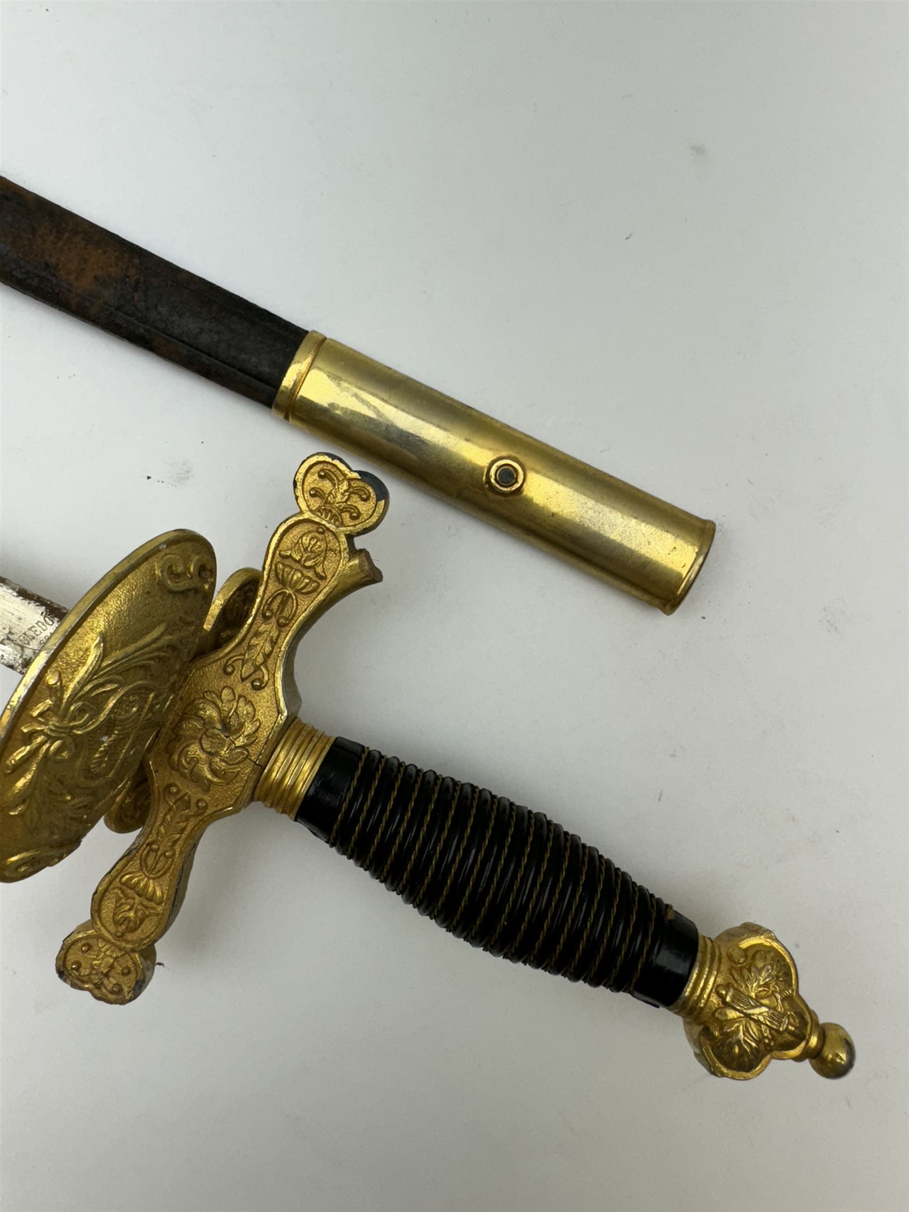 Ceremonial sword, the 75cm blade marked Toledo, Spain, gilt handle with black wire-bound grip  with leather scabbard with gilt tip, L94cm 