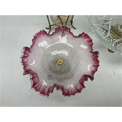20th century moulded glass and gilt centre piece bowl with carrying handle and ornate trefoil base, together with frilled cranberry edge glass comport with ornate gilt base, and further centre piece with  large glass handle of twisted form, tallest H54cm