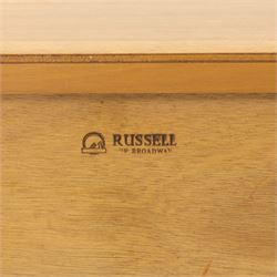 Gordon Russell - mid century modern teak sideboard, the rectangular top with rounded edges over twin cupboards and three central drawers, fitted with circular wooden pulls, on tapered supports, reflecting the firm’s commitment to simplicity and quality materials during the post-war design period