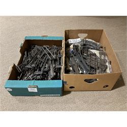 '0' gauge - large quantity of two-rail track with fixing clips including curves, straights, points, cross-overs etc; and boxed Meccano A3 Power Control Units; in four boxes