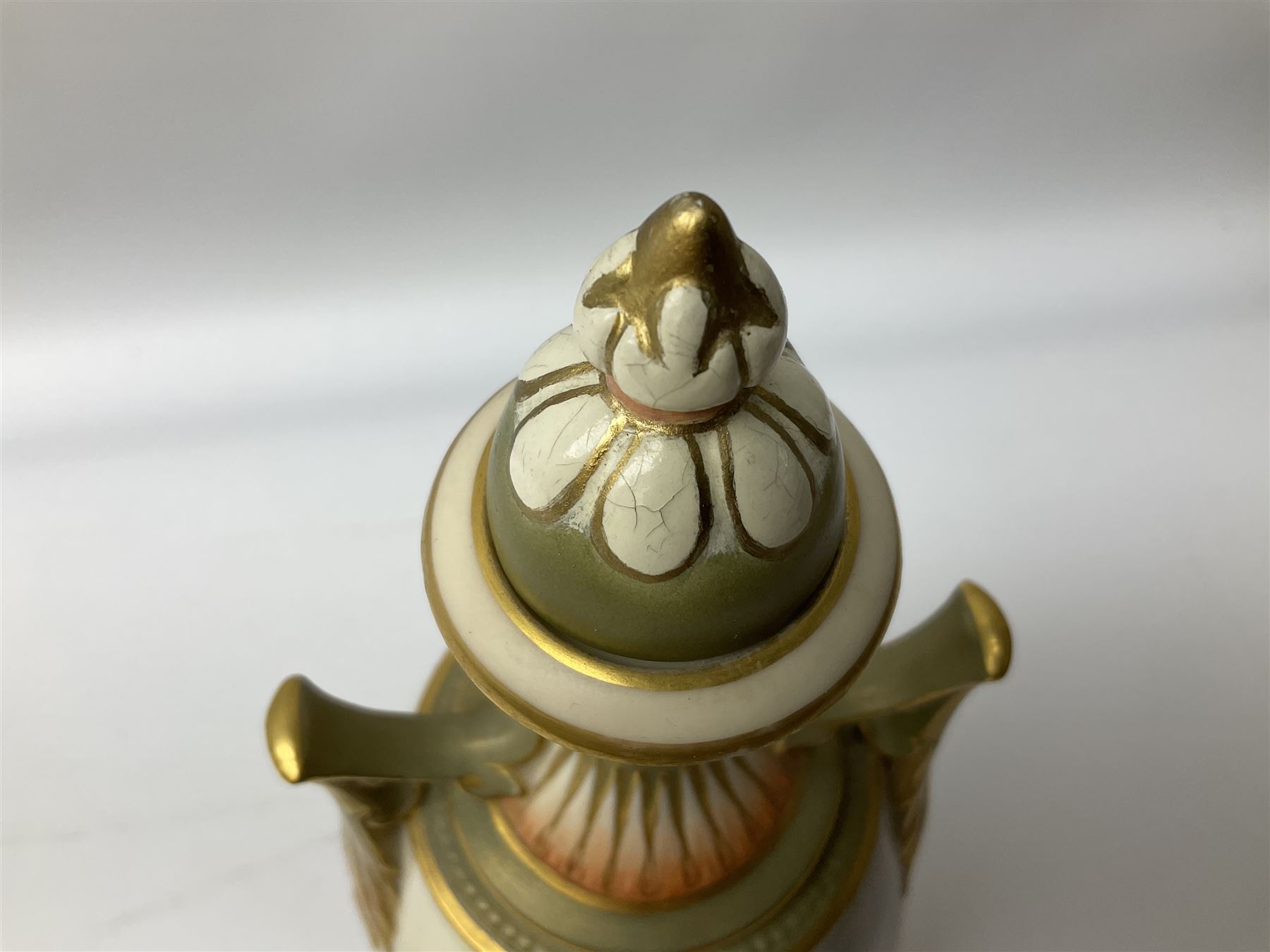 Early 20th century Royal Worcester vase decorated by Harry Davis, of ovoid form with twin acanthus mounted handles and waisted high neck supporting a domed cover, upon a circular foot, the body hand painted with sheep in a highland landscape, signed H Davis, with puce printed marks beneath including shape number 2425, and date code for 1907, H27.5cm