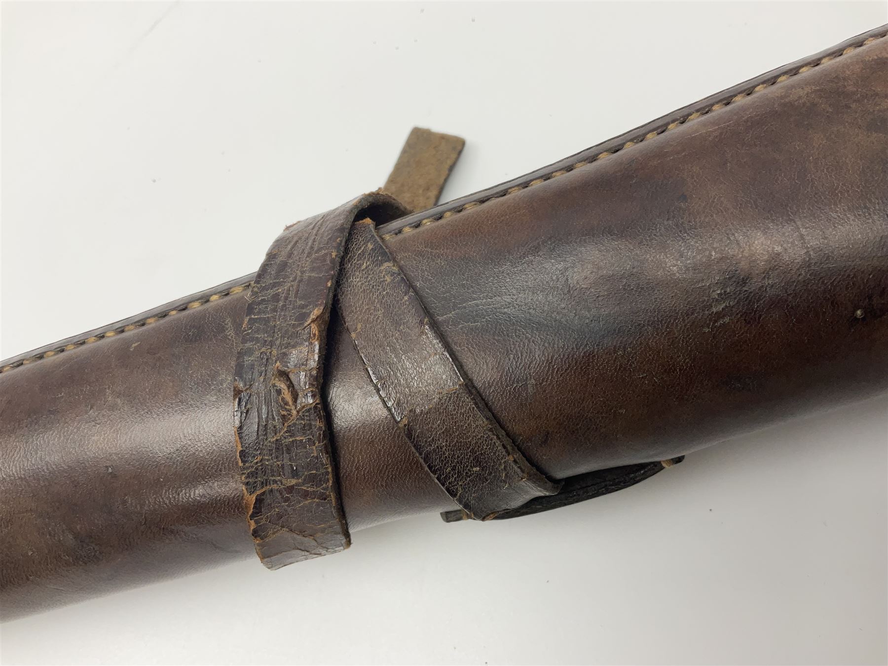 19th century telescopic hunting horn, the bell engraved 'The Beaufort', with makers mark Kohler & Son, makers, 61 Victoria Street, Westminster (from Covent garden) London, in a leather sheath, horn full extended L91cm 