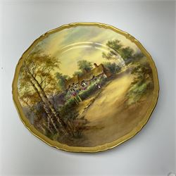 A Royal Worcester cabinet plate, decorated with and titled verso Anne Hathaway's Cottage, signed H Stinton, within a gilt rim, with black printed mark beneath, D27cm