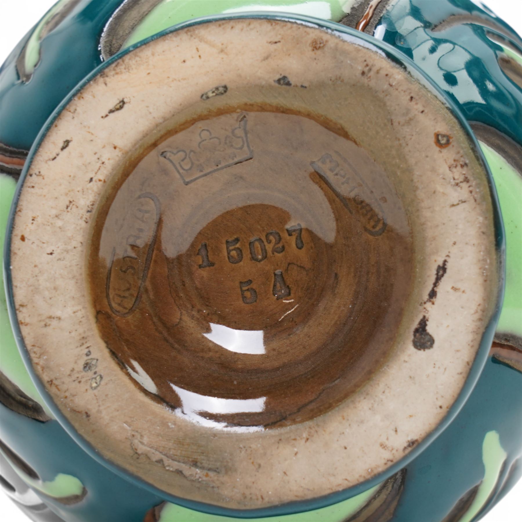 Pair of early 20th century Austrian Amphora vases, of tubular form, decorated with Art Nouveau style thistles and leaves, impressed marks to base including a crown, H25.5cm (2)