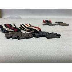 Two WW1 German medals - copy Cross of Honour with swords (combatants); Cross of Honour without swords (non-combatants); and two WW2 German medals - War Merit Medal; and War Merit Cross; all with ribbons (4)