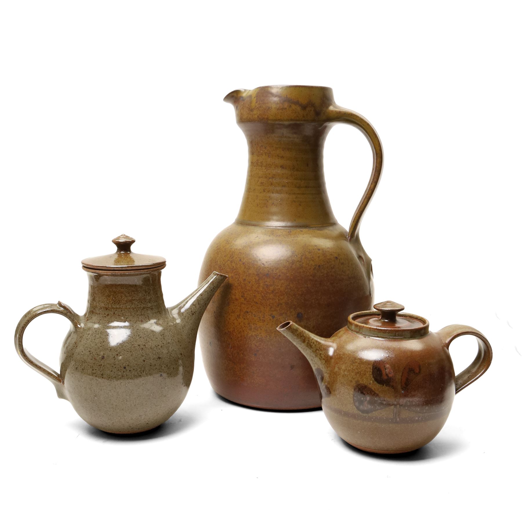 David Lloyd Jones (1928-1994): Three works, a large jug and two teapots, in typical brown glaze, each stamped, larger jug H39cm (3)