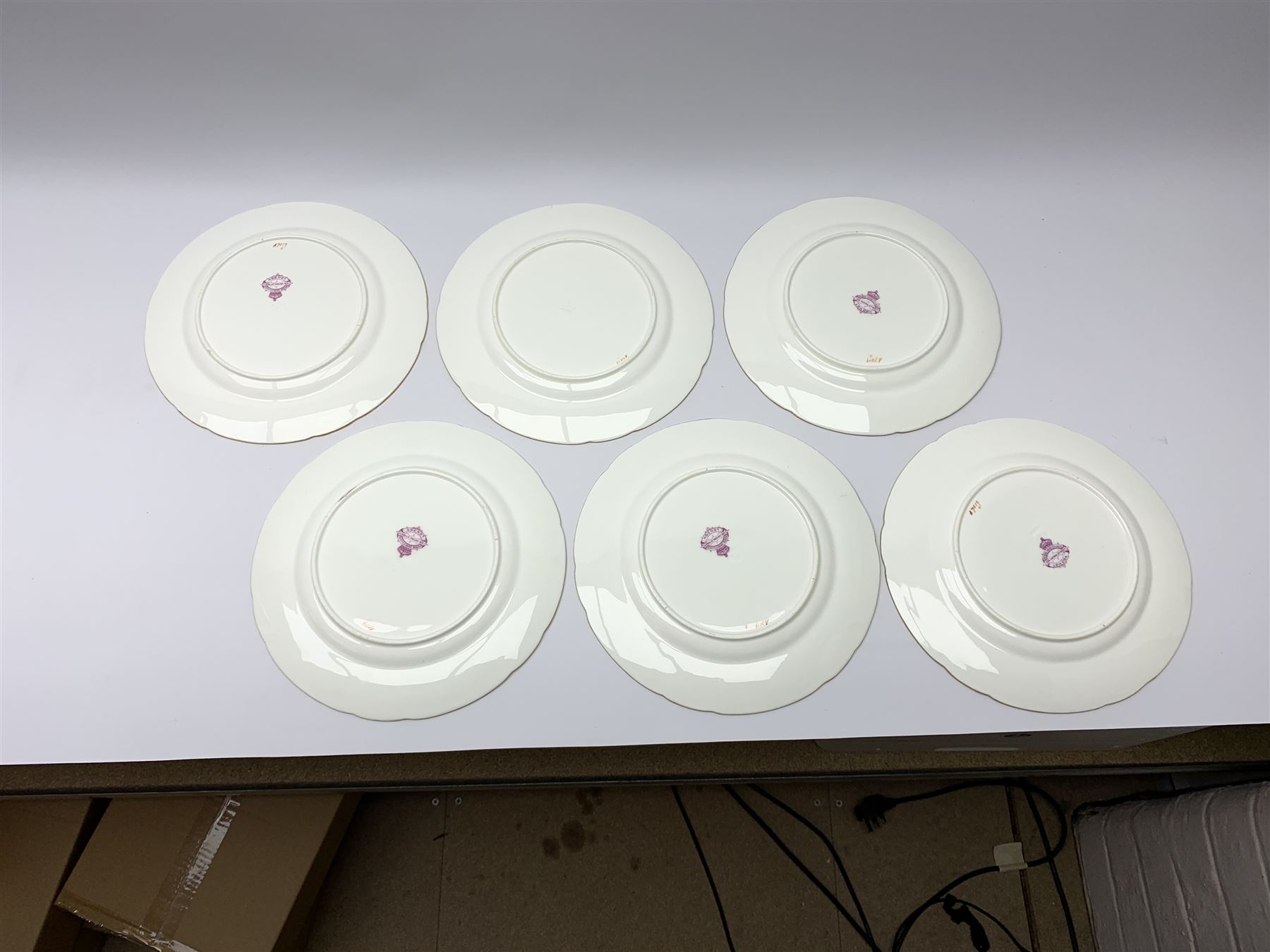 19th century Minton dessert service, comprising four comports, one tazza, and twelve plates, each hand painted with birds perched upon branches, and further detailed with insects and heightened in gilt, with printed retailers mark beneath for John Mortlock Oxford Street London, and impressed Minton mark to most, comport H13.5cm, plates D23.5cm. 
