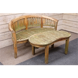  Hardwood garden bench, slatted back with curved top rail, slatted serpentine seat on square supports, W164cm, D67cm, H88cm and a similar kidney shaped table, W120cm, D59cm, H51cm    