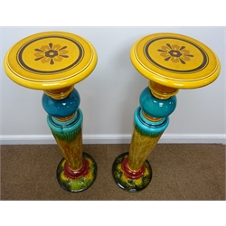  Pair Victorian turquoise and amber glazed jardiniere stands of tapered form with circular top and acanthus leaf moulded base, H103cm  