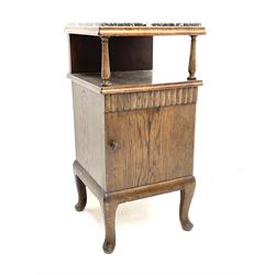 Continental oak bedside cabinet, marble top, above single shelf and single cupboard enclosing interior, raised on cabriole supports 