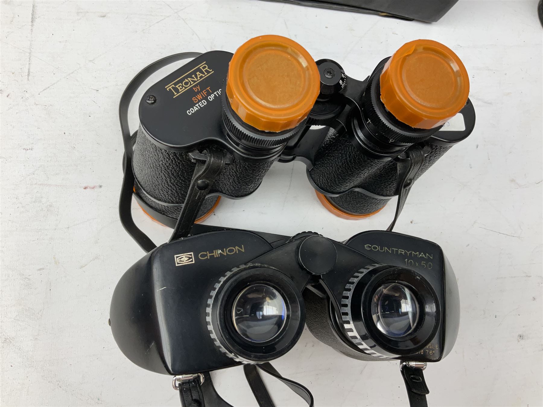 Twelve pairs of binoculars to include BWCF 7x35 Extra Wide Angle, Carl Zeiss Jena Delturis 8x24, Carl Zeiss Jena Jenoptem 8x30W, Chinon Countryman 10x50,  Ajax 8x30, Regent 16x50, etc,  some with cases