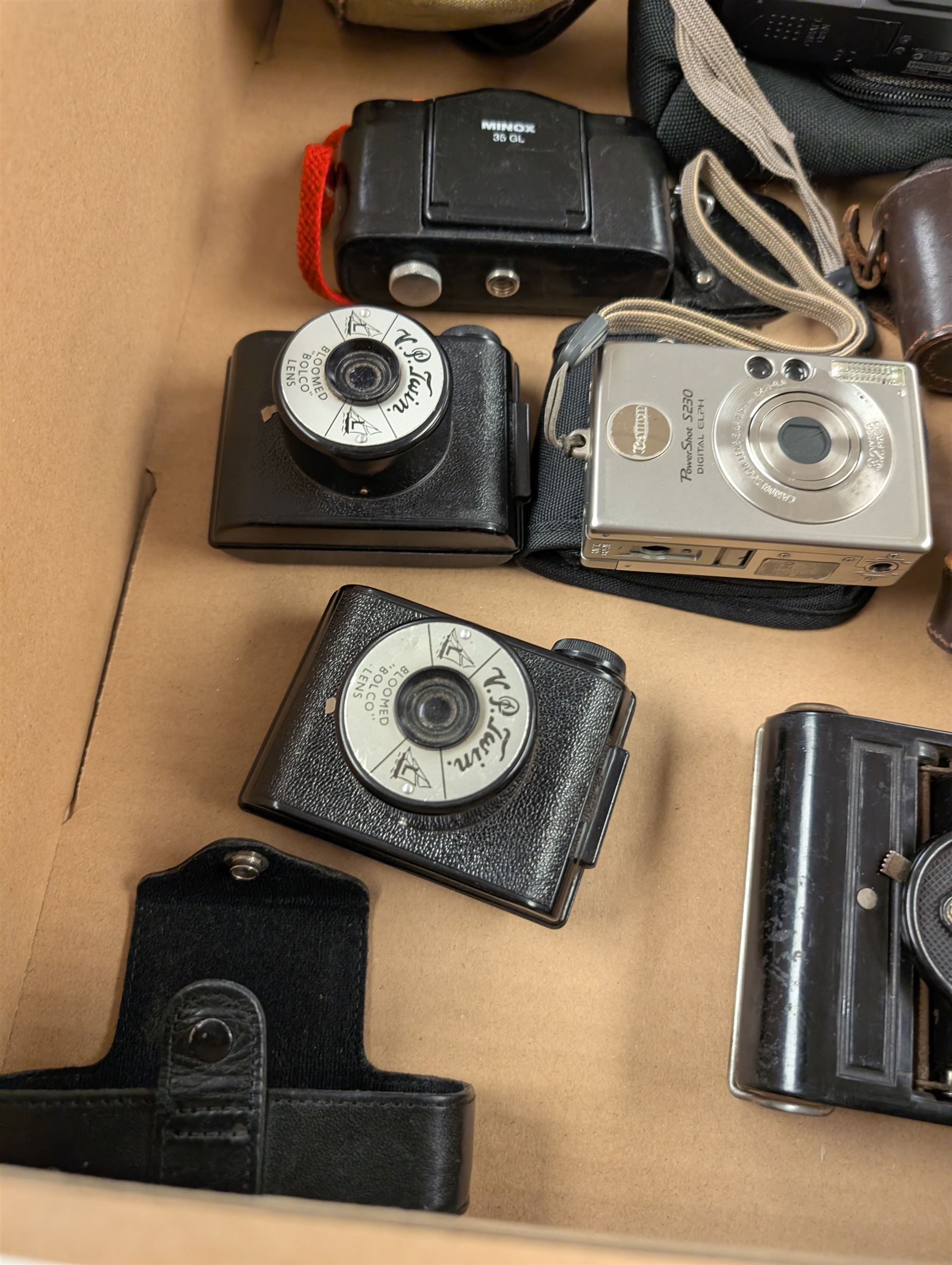 Collection of vintage cameras, including two V Twin with Bloomed Belco Lens, Ensign Ful Vue, Ranjar No. 6, CME Comet S, etc together with two Canon Powershot Digital cameras models S230 and S70