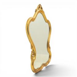 Rococo design gilt wall mirror, shaped and moulded frame, serpentine lower apron, enclosing a plain mirror 