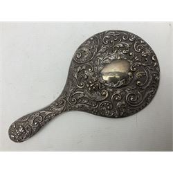 Silver mounted dressing table mirror, embossed with birds, masks, and foliate and C scrolls, hallmarked Birmingham, and fruit knife with mother of pearl handle and silver blade, (2)