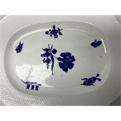 Three 19th century plates, comprising two circular examples and one oblong, each with osier moulded sides, the centres decorated in underglaze blue with Gillyflower type pattern, circular examples D25cm oblong example W27cm