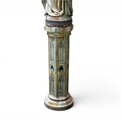 Farran stone garden statue depicting a hooded monk standing in flowing robes in circular form, set upon Gothic pedestal with arched panels, featuring lead hands and script band