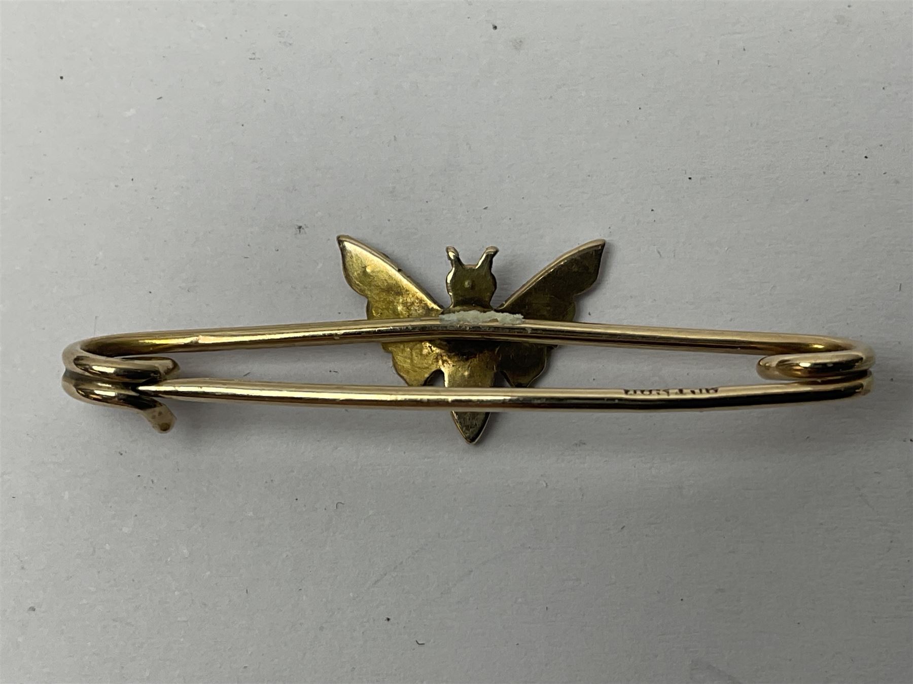 9ct gold pear butterfly brooch, 9ct gold stone set ring and an silver fob watch, all stamped or hallmarked 