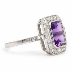 Platinum amethyst and diamond cluster ring, single octagonal cut amethyst  of approx 3.00 carat, surrounded by milgrain set baguette and round cut diamonds and diamond set shoulders, hallmarked, total diamond weight approx 0.25 carat