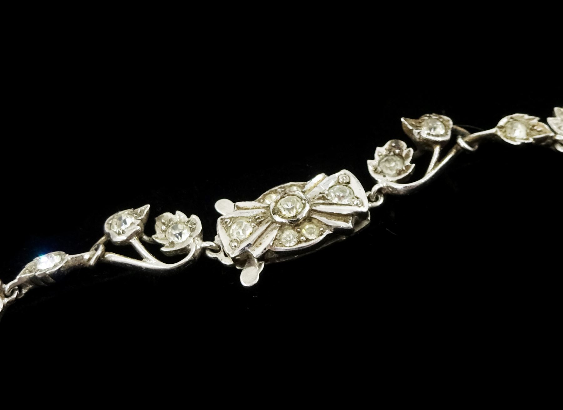 Silver synthetic sapphire and white paste stone set flower necklace, brooch and matching pair of earrings, stamped sterling