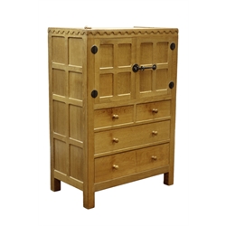 'Mouseman' panelled oak tallboy, cupboard above two short and two long drawers, wrought metal fittings, by Robert Thompson of Kilburn, W84cm, H124cm, D49cm  