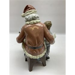 Lladro figure, A Special Toy, modelled as Father Christmas with a young boy, with original box, no 5971, year issued 1993, year retired 1996, H26cm