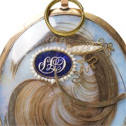 English School (Early 19th century): Miniature Portrait of a Gentleman, watercolour on ivory, mounted within gold frame, with mourning lock of hair verso 7.5cm x 6cm 
This item has been registered for sale under Section 10 of the APHA Ivory Act