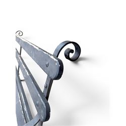 Coalbrookdale - rare pair of wrought iron and slatted wood garden benches, the twin wrought iron strapwork bench-ends formed of four scrolls over splayed feet, number 77 in the Coalbrookdale Castings Catalogue (see illustration)