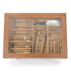 Shop display humidor with lockable glazed lifting lid, the removable tray containing selec...