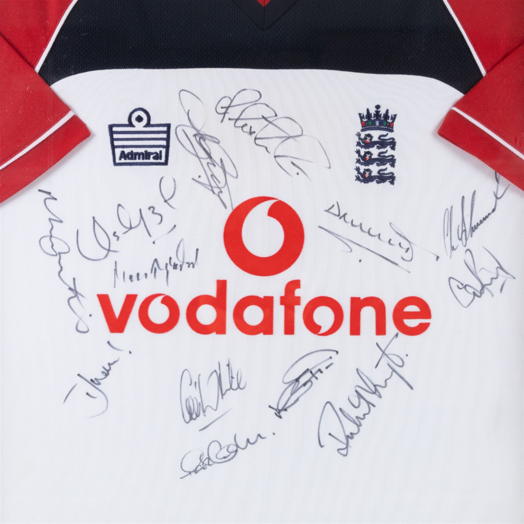 Signed 2002/2003 season England Cricket shirt, signed by thirteen England players including Marcus Trescothick, Darren Gough and Craig White, contained within a glazed wooden display case, frame H96cm