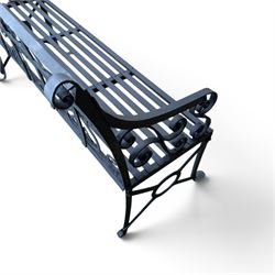 Regency period wrought iron garden bench, hand forged in wrought iron and finished in matt black paint, decorated with intricate scrollwork and featuring circular geometric ends, strapwork seat