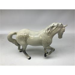 Collection of Beswick horses, including grey horse no.701, palomino foal no 836, grey stocky jogging mare no.855 etc, together two Royal Doulton horses, (8)
