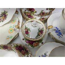 Royal albert Country Rose tea set for six, comprising teacups, saucers, dessert plates, cake plate, covered sucrier and milk jug, together with another tea set  