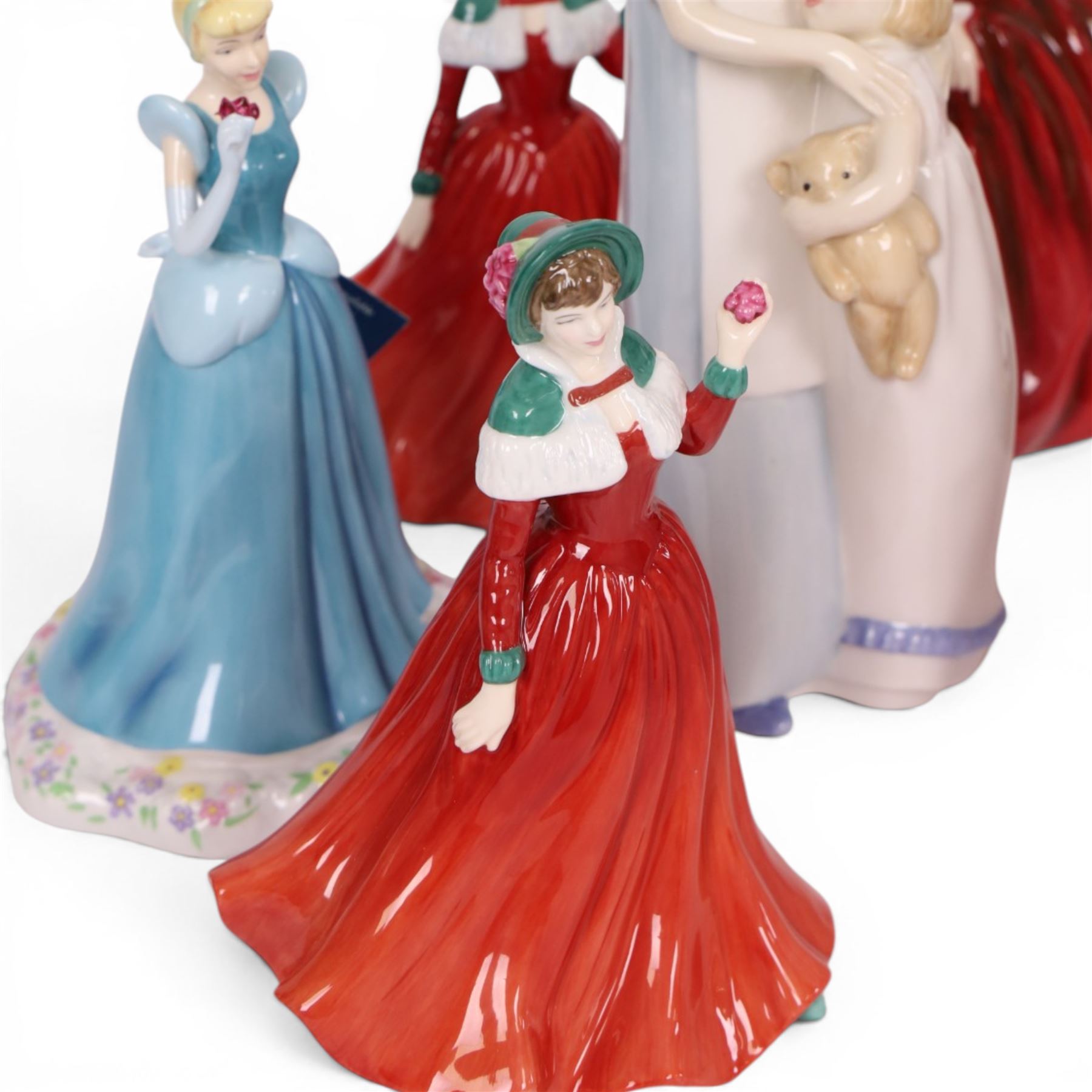 Collection of Royal Doulton figures including Autumn Stroll, April, Cinderella, The old Balloon Seller, Reflections etc 